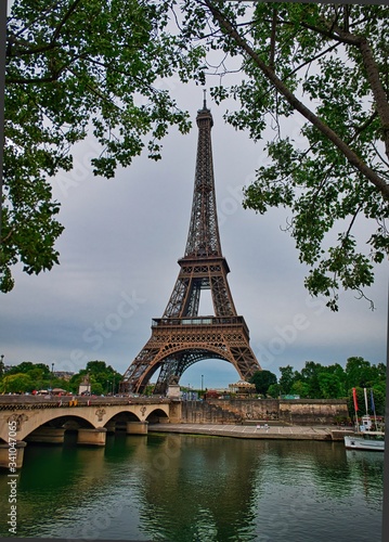 View on the famous paris eiffel tower from the promenade of the Seine . © othman