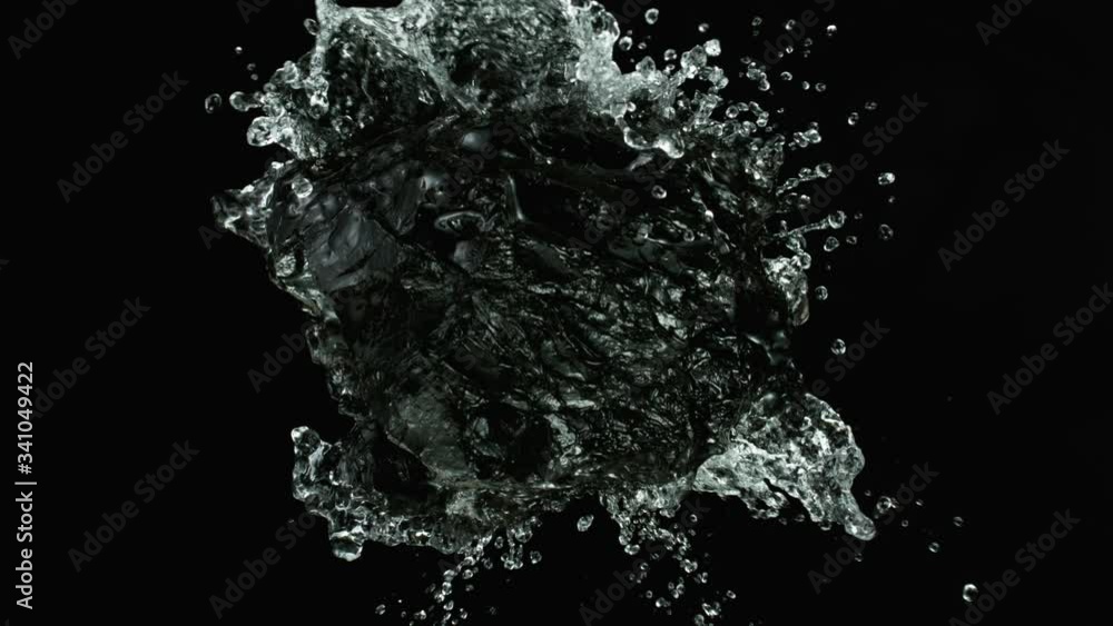 Piece of coal with water splashing. Cosmetic concept of skin and face care. Filmed on super slow motion camera, 1000 fps. Piece of coal with water splashing. Cosmetic concept of skin and face care. Filmed on super slow motion camera, 1000 fps.