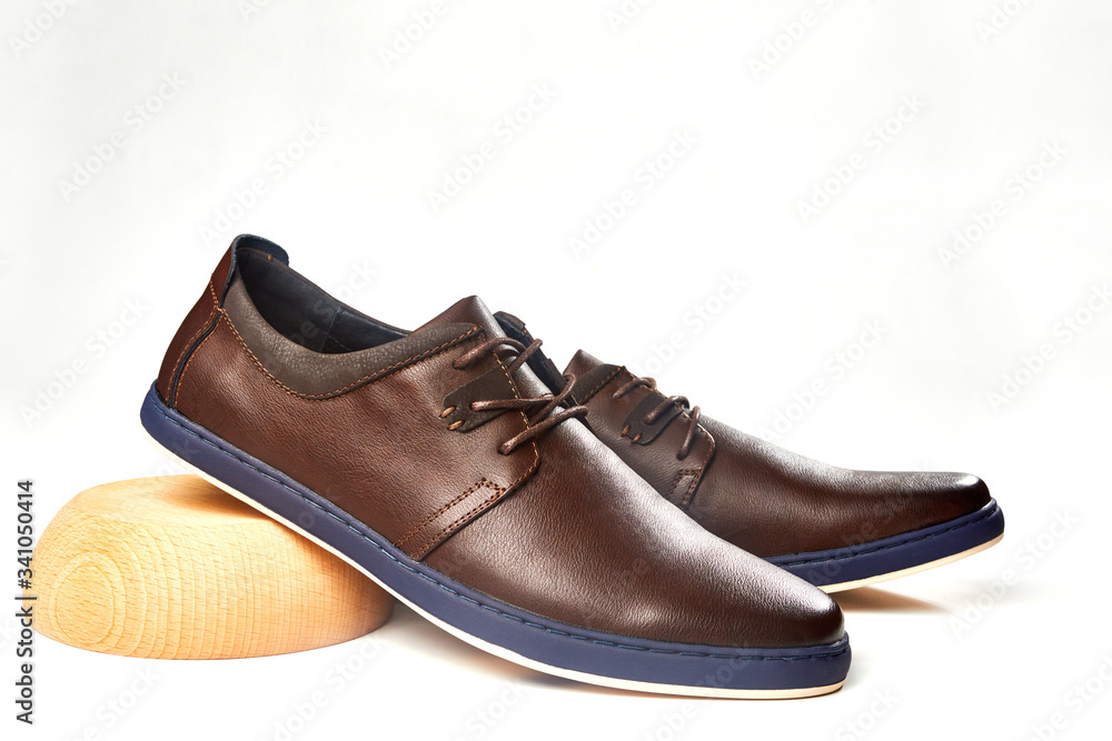 Men fashion brown shoe leather over white background. Pair casual stylish footwear. Men fashion brown shoe leather over white background. Pair casual stylish footwear.