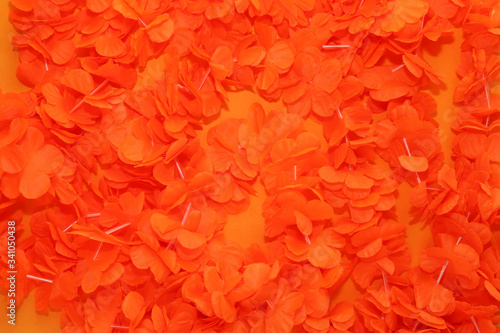 Orange background with typical King's Day accessories. 