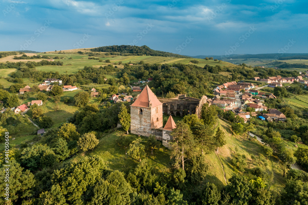 Aerial drone view of Slimnic Fortress (Stolzenburg), located on a Burgbasch hill in  Sibiu region, Romania