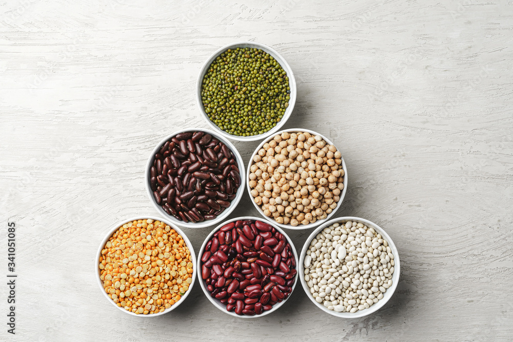 Beans assortment on white stone table Beans assortment on white stone table