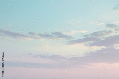 pastel pink blue evening sky with clouds