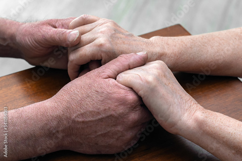 Fototapeta Naklejka Na Ścianę i Meble -  senior family couple holding old hands, psychological support concept