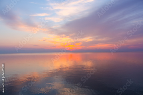 Inspirational calm sea with sunset sky. Meditation ocean and sky background. Colorful horizon over the water