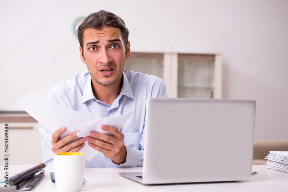 Young male businessman working at home Young male businessman working at home