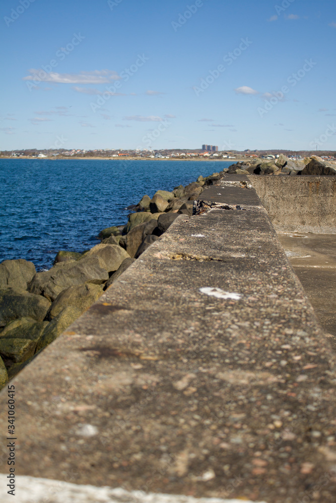 A breakwater from the embankment of huge stones to protect the beach from the sea wave A breakwater from the embankment of huge stones to protect the beach from the sea wave