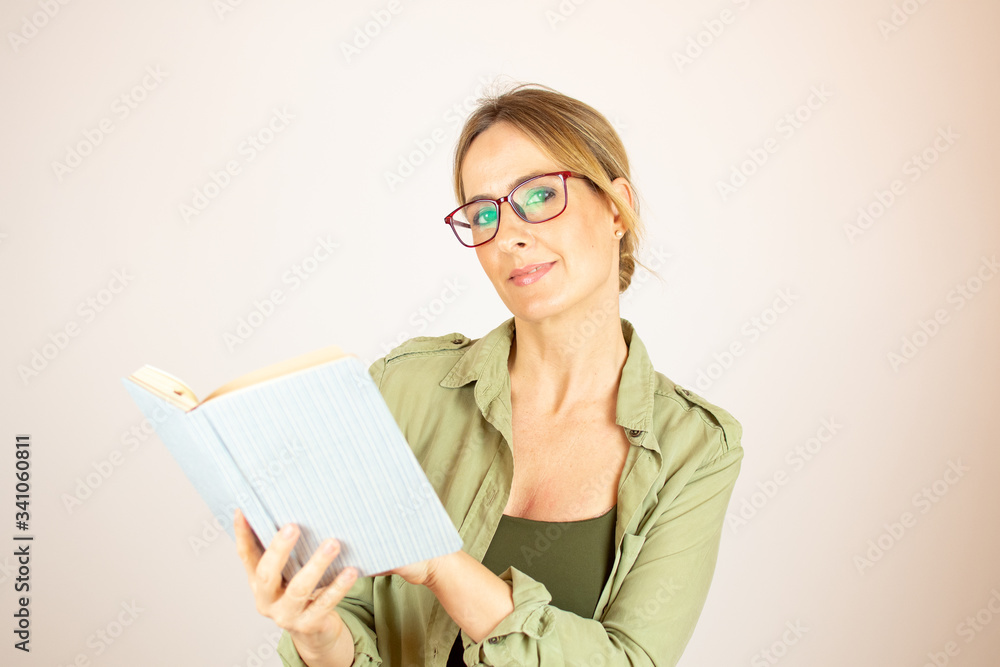 Beautiful woman with glasses reading a book Beautiful woman with glasses reading a book