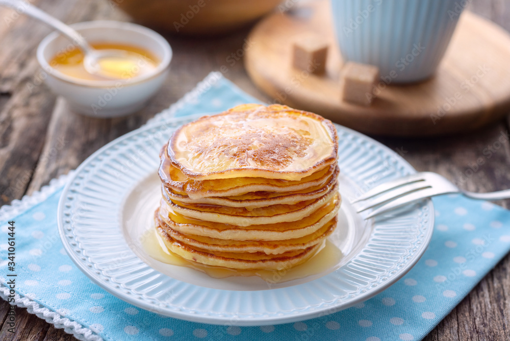 Pancake for breakfast in a blue plate. Pancake for breakfast in a blue plate.