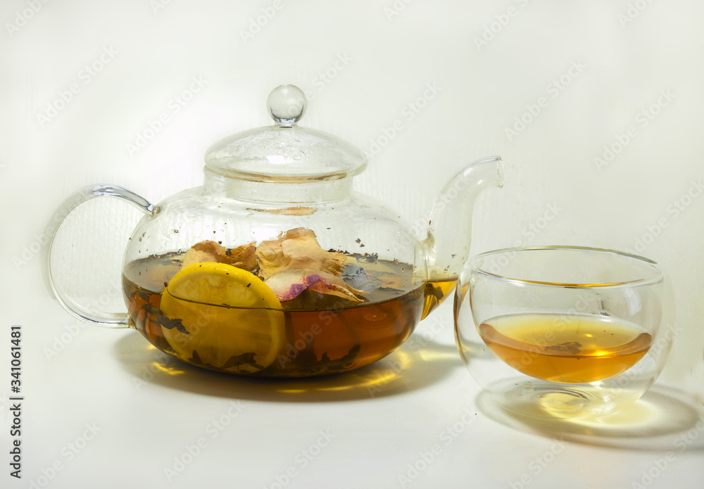 hot tea with rose petals and lemon in a teapot hot tea with rose petals and lemon in a teapot
