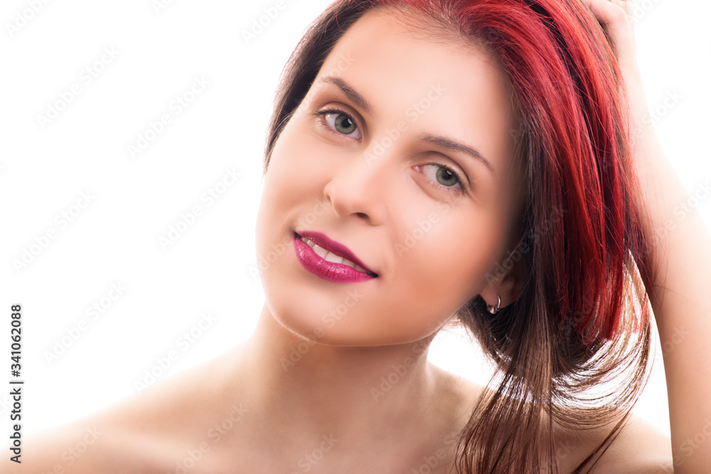 Fototapeta premium Portrait of a young girl holding her hair