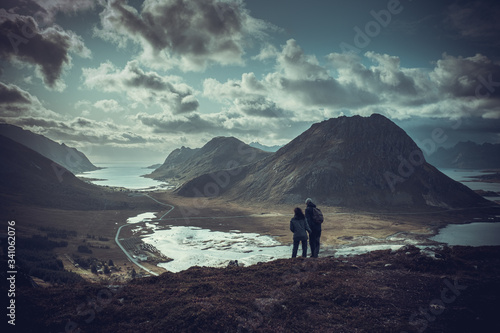 trekking on the Lofoten islands, a couple on top of a mountain range