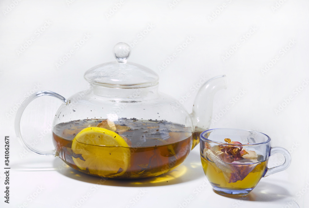 hot tea with rose petals and lemon in a teapot hot tea with rose petals and lemon in a teapot