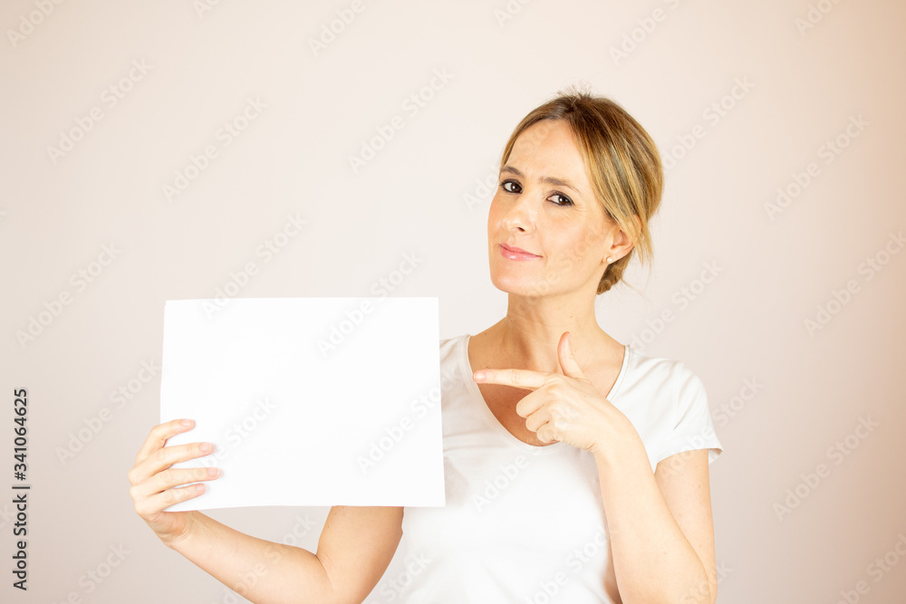 Beautiful woman with paper looking into the camera Beautiful woman with paper looking into the camera