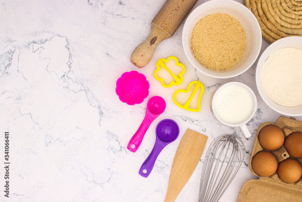 Cooking groceries for baking and making cookies on the kitchen table Cooking groceries for baking and making cookies on the kitchen table