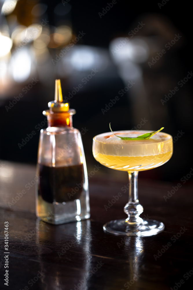 Sidecar cocktail standing on the bar. Night club scenery. Sidecar cocktail standing on the bar. Night club scenery.