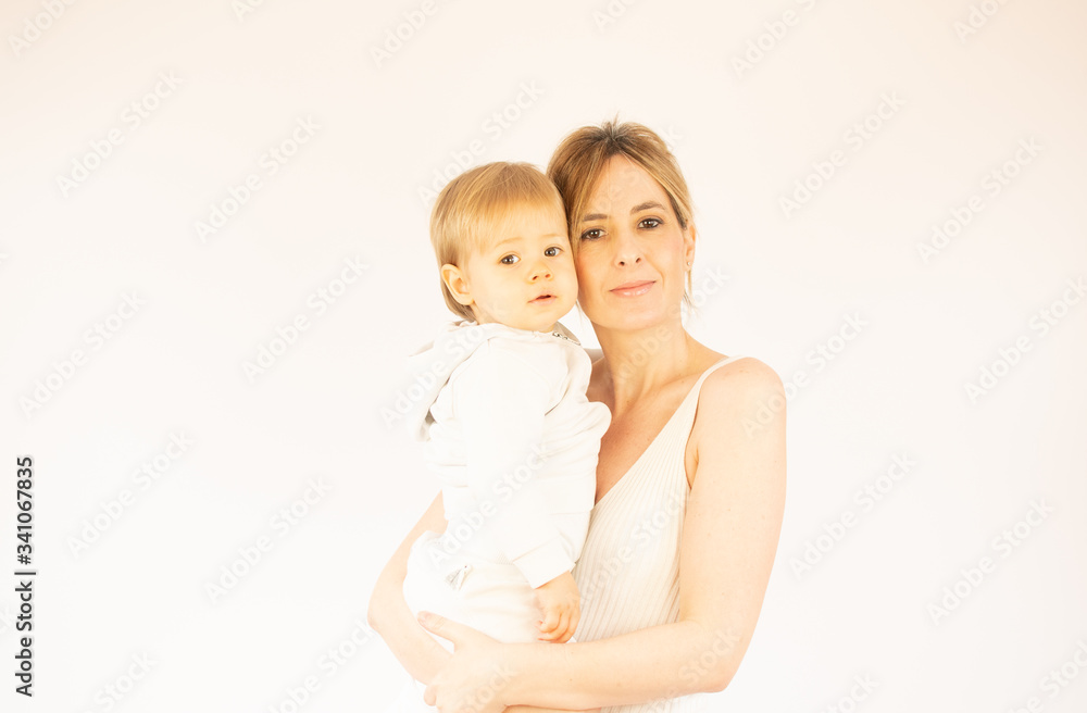 Beautiful woman with her baby son in her arms Beautiful woman with her baby son in her arms
