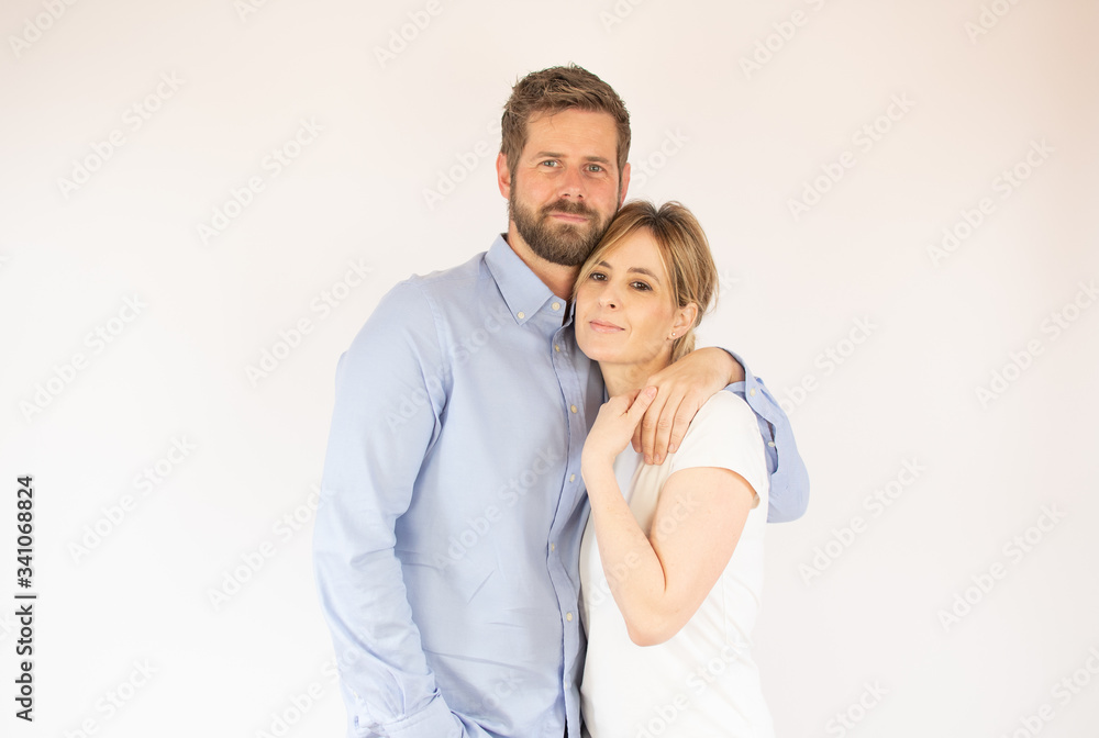 handsome couple in love looking into the camera handsome couple in love looking into the camera