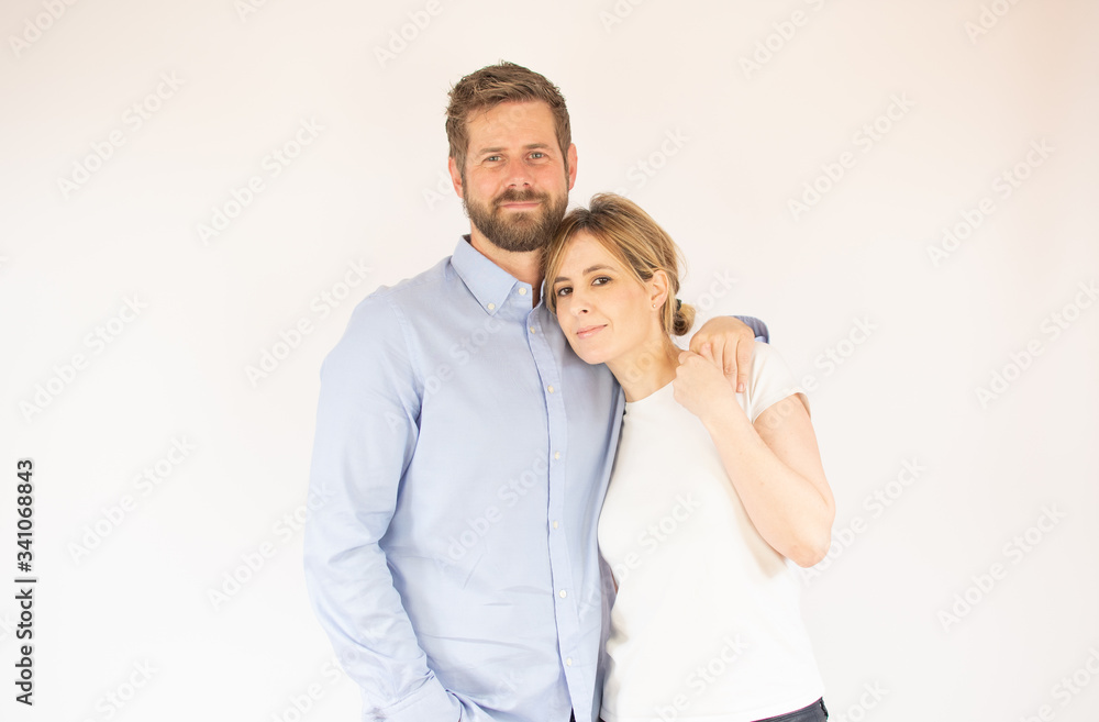 handsome couple in love looking into the camera handsome couple in love looking into the camera