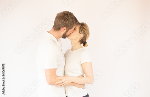 Handsome couple in love is kissing