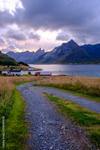 village road to home in norway among fjords and bay