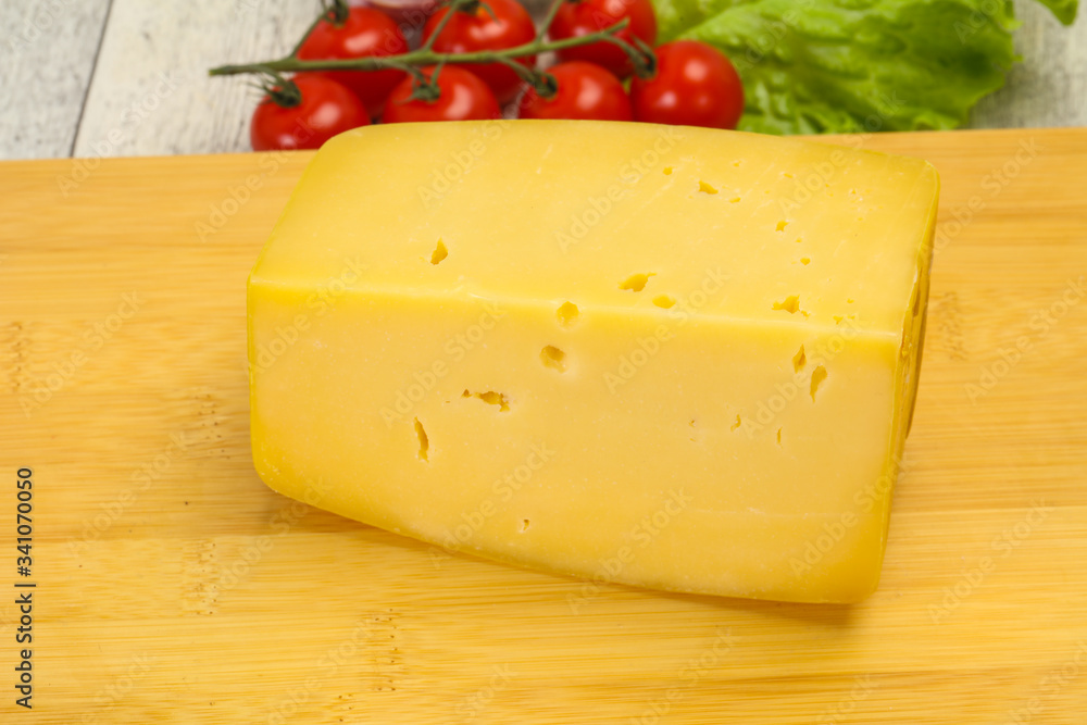 Hard yellow tasty cheese brick Hard yellow tasty cheese brick