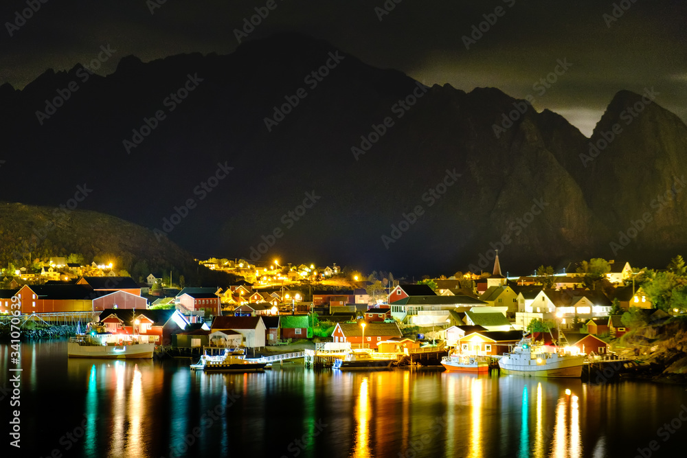 view of the Reine village at night, Lofoten islands, Rorbu in the light of lanterns