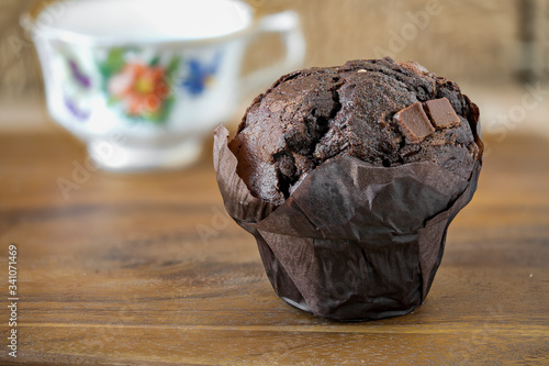 Photography Chocolate muffin on a wooden board