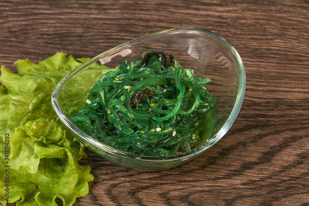 Green Chuka Seaweed Salad Isolated on White Background Top View. Wakame Sea Kelp Salat