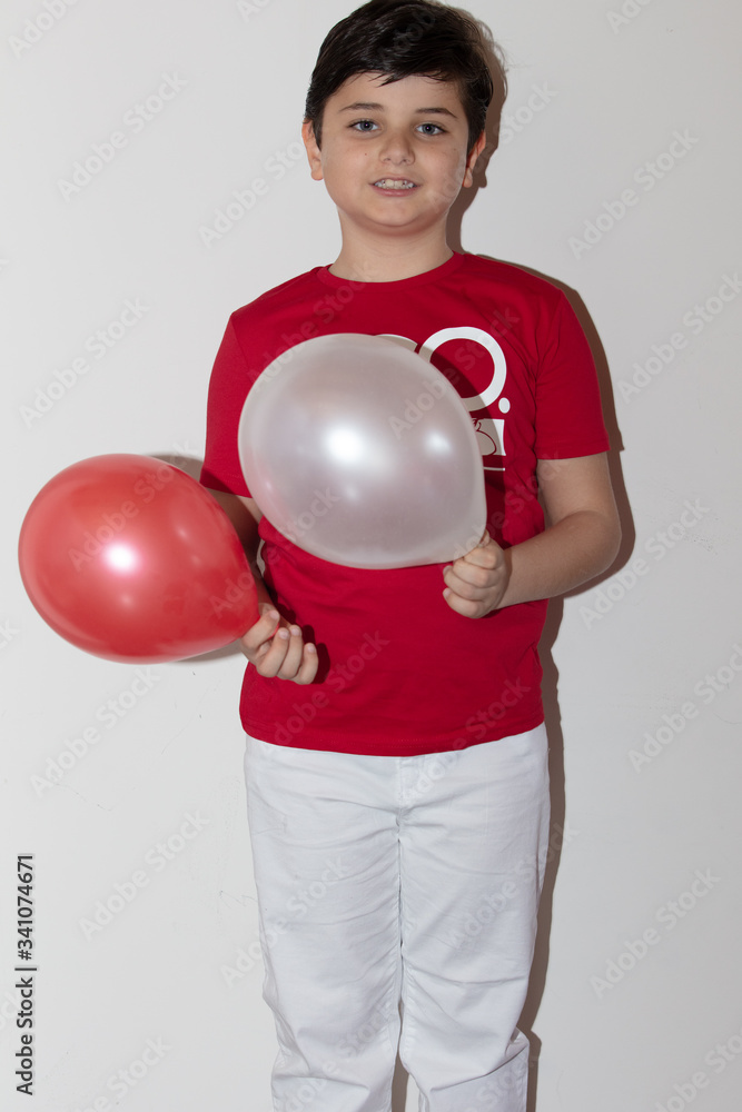 happy little kid with Turkish flag t-shirt . Patriotic holiday. Adorable child celebrates national holidays. white background with copy space for text happy little kid with Turkish flag t-shirt . Patriotic holiday. Adorable child celebrates national holidays. white background with copy space for text