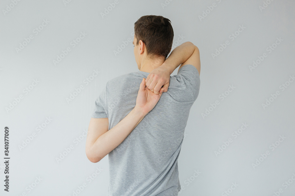Young man goes in for sports at home. Sports activities at home Young man goes in for sports at home. Sports activities at home