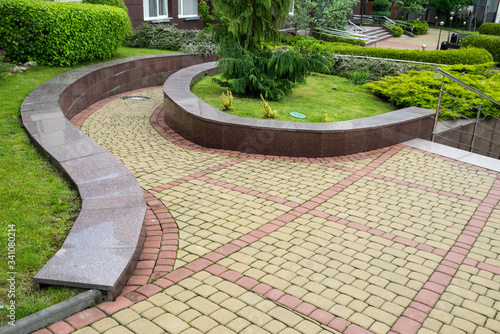curved stone walkway from pavers in landscape design and sidewalk decoration