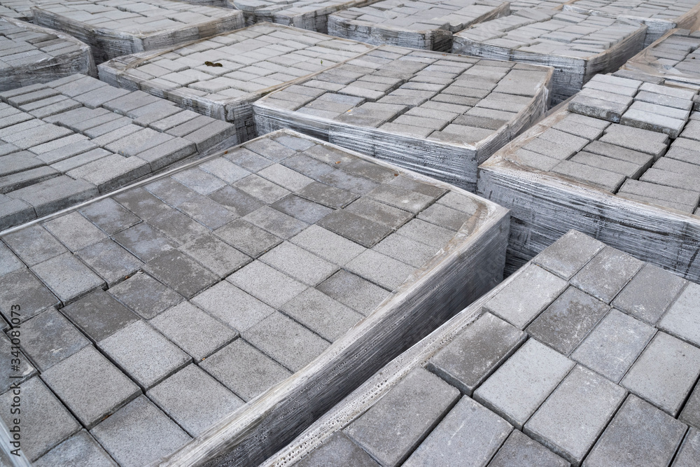 Fototapeta premium concrete paving stones, folded pile of stone for laying the track