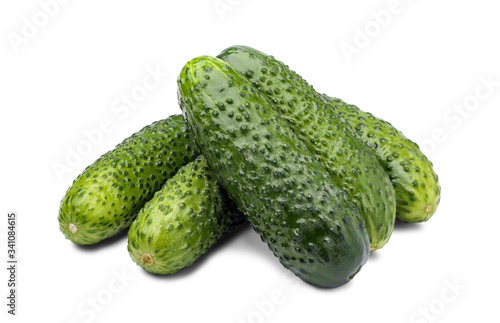Pile of fresh cucumbers isolated on white background.