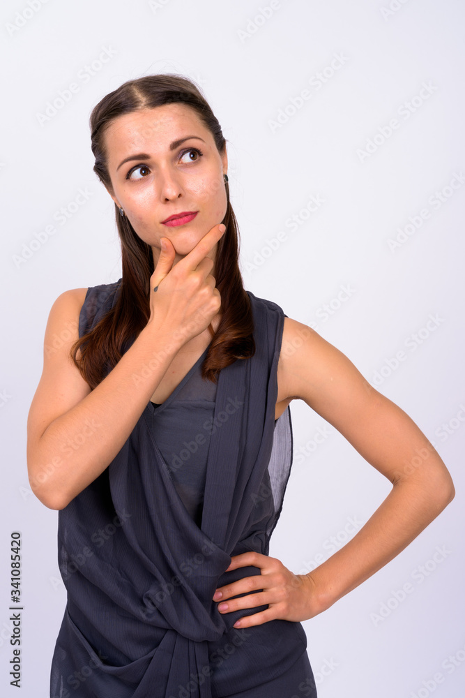 Portrait of young beautiful woman thinking and looking up Portrait of young beautiful woman thinking and looking up