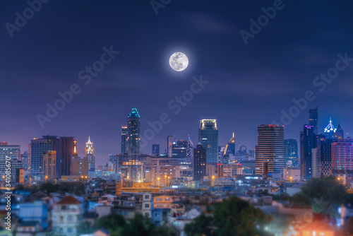 night view of the city of bangkok and moon