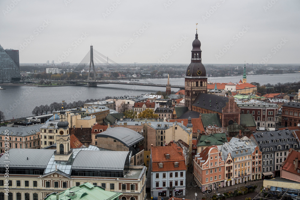 view of cute old town with church and bridge in riga latvia