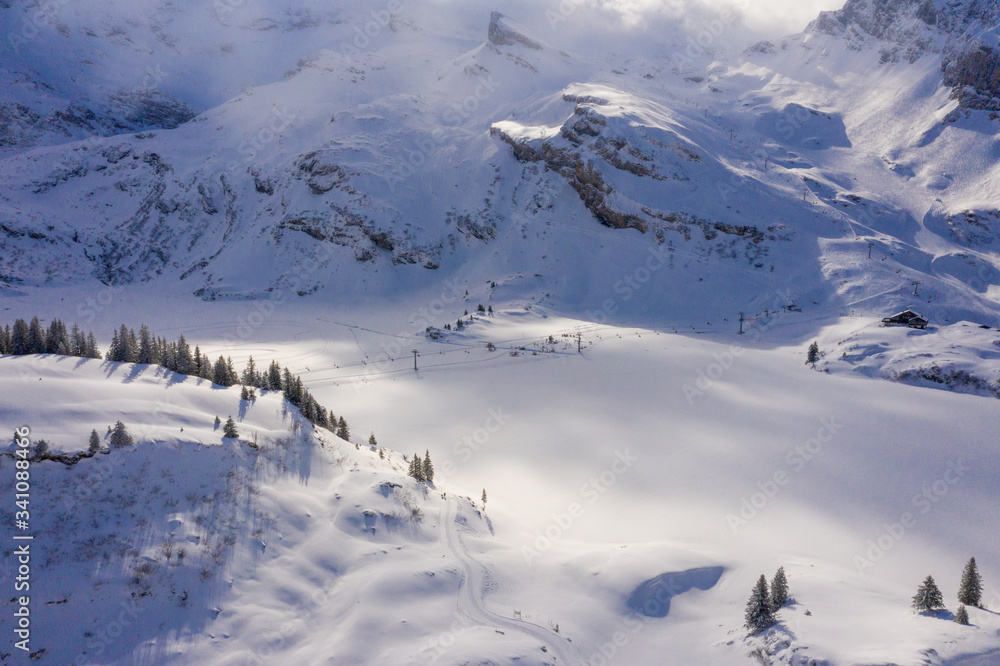 Wonderful snowy winter landscape in the Alps - aerial shot