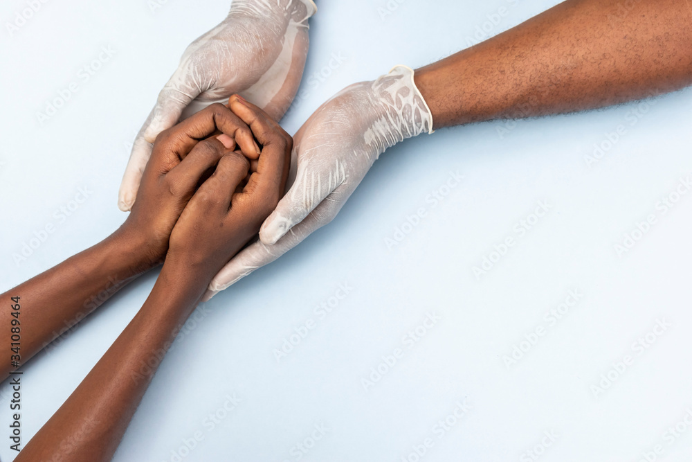 Fototapeta premium african doctor holding a patient, giving instructions and support