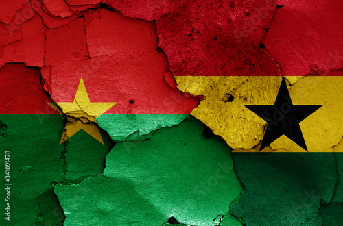 flags of Burkina Faso and Ghana painted on cracked wall