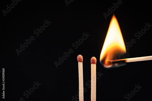 Burning flame to a matchstick