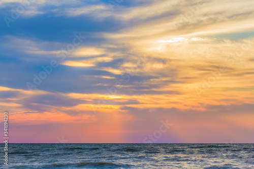 Scenic sunset over the blue evening sea