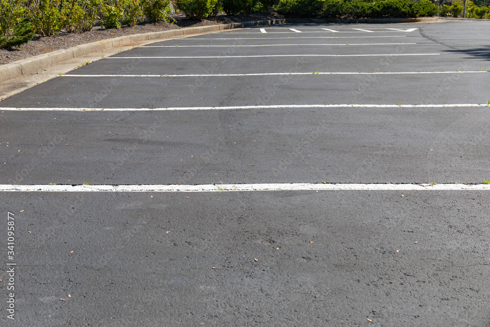 Lined and empty asphalt parking lot, horizontal aspect