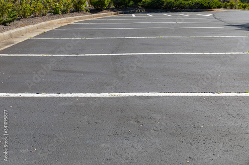 Lined and empty asphalt parking lot, horizontal aspect