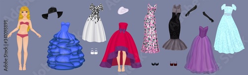 Fotografija Paper doll of a pretty blond girl with a variety of paper evening dresses, hats,