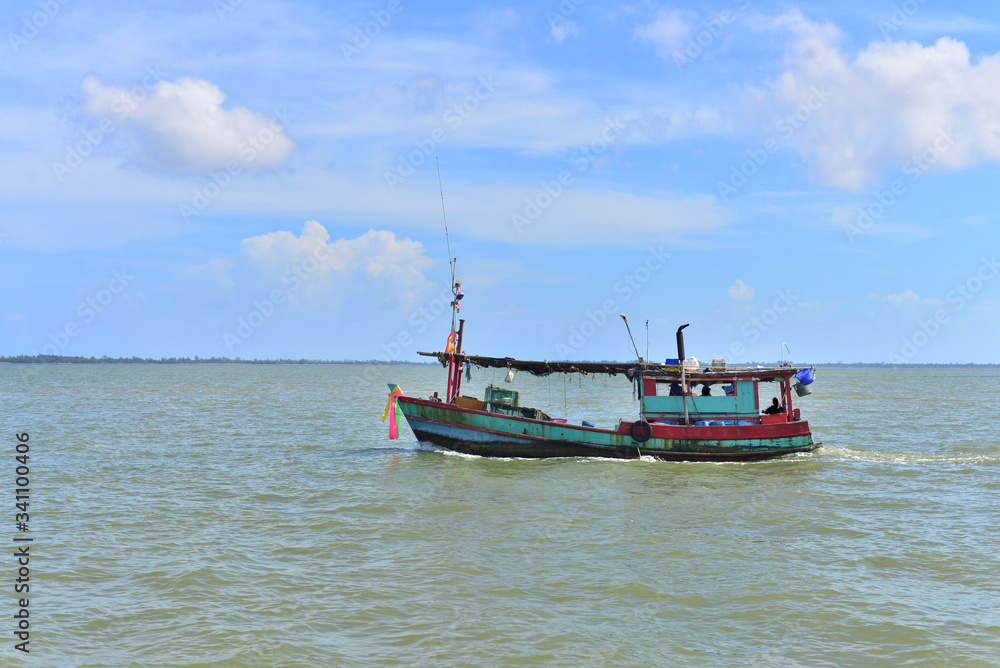 Fishing boat on the sea and blue sky of Thailand