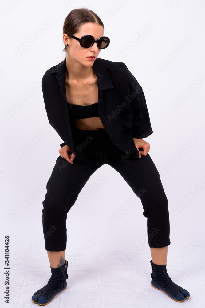 Full body shot of young beautiful woman as secret agent Full body shot of young beautiful woman as secret agent