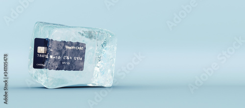 Credit card frozen in ice cube on blue background 3D Rendering photo