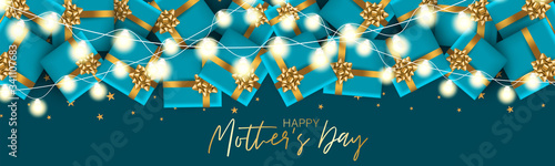 Mother's Day celebration banner or website header background. Gift boxes with gold bow on blue background with lettering and garland lights. Vector illustration.