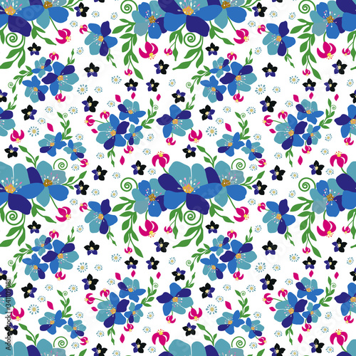Seamless floral background. Blue flowers of various sizes are scattered in a chaotic order